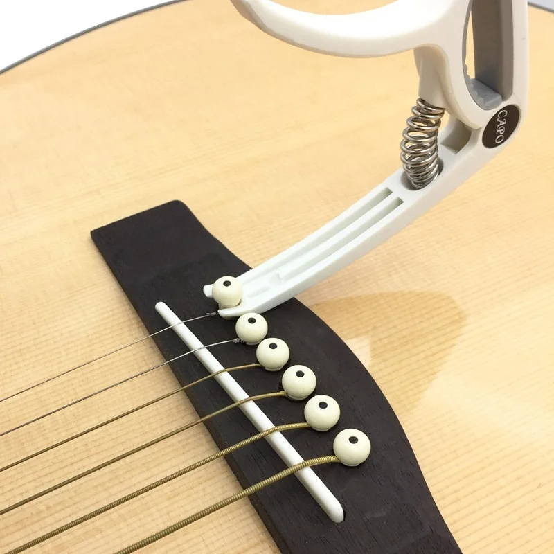 Capodastre de guitare en plast - Musical Instrument Names avis et prix